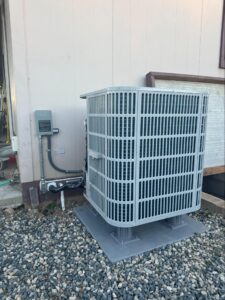 New AC condenser unit installed outside home in Tehachapi, CA by Origin Heating & Air
